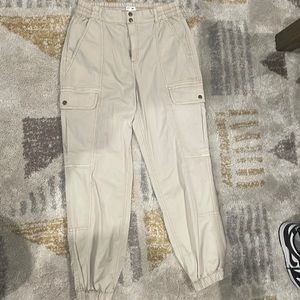 Khaki Cargo pants with tight bottom.